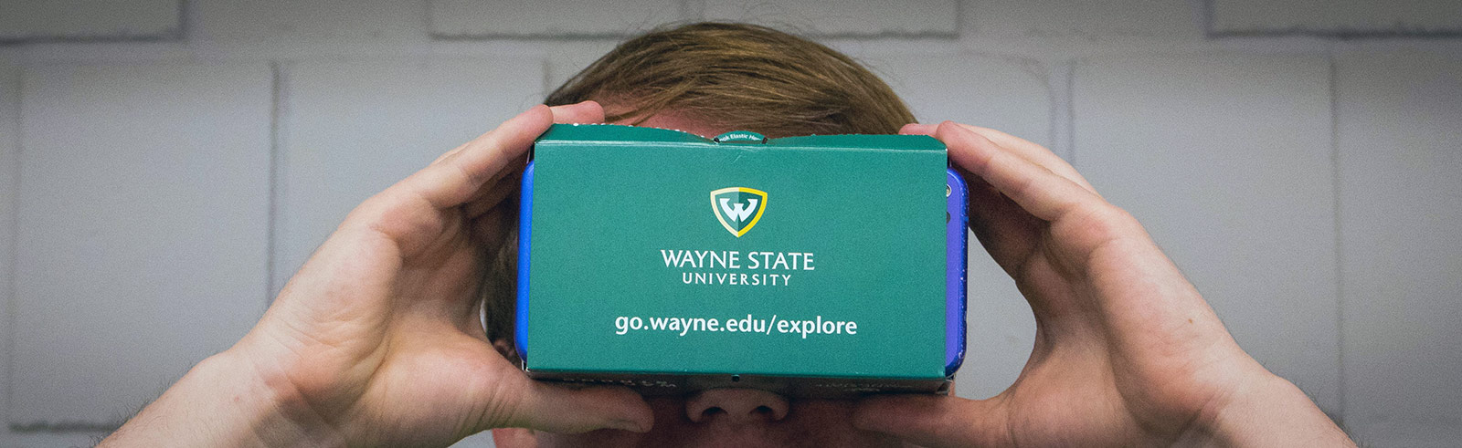 Sr. System Software Engineer for C&IT DeskTech, Eric Greene, demonstrates the new Wayne State Virtual Experience App Friday, Sept. 21, 2018.